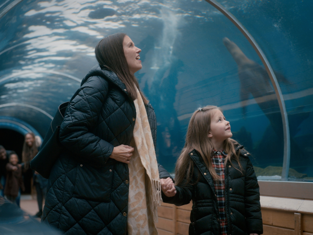 Visitors in underwater sea lion tunnel